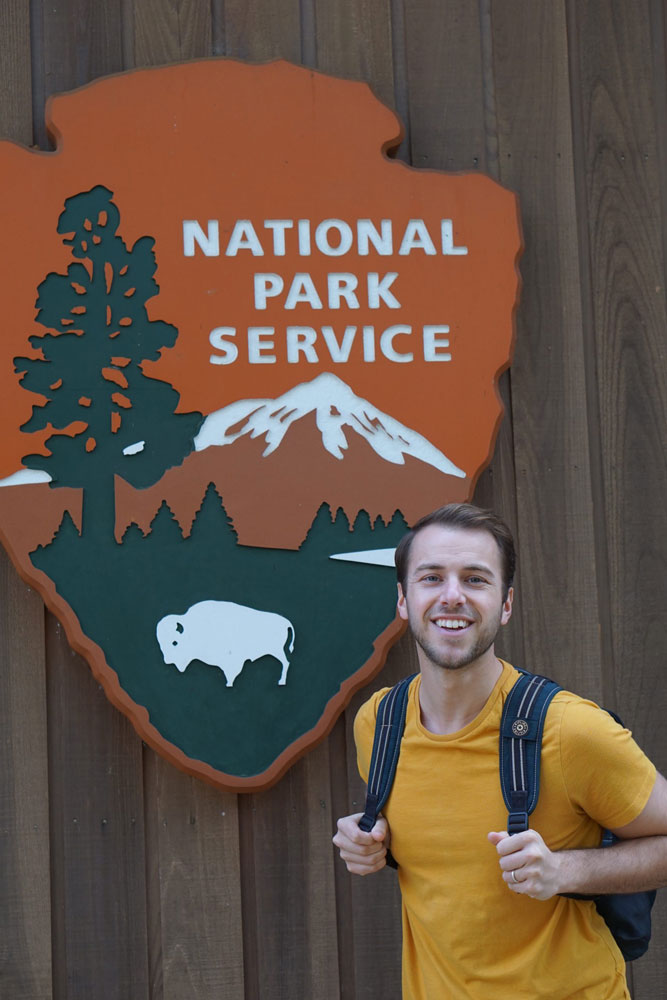 Milo Anderson in front of National Park sign