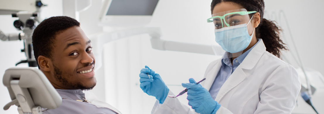 Dentist and smiling patient