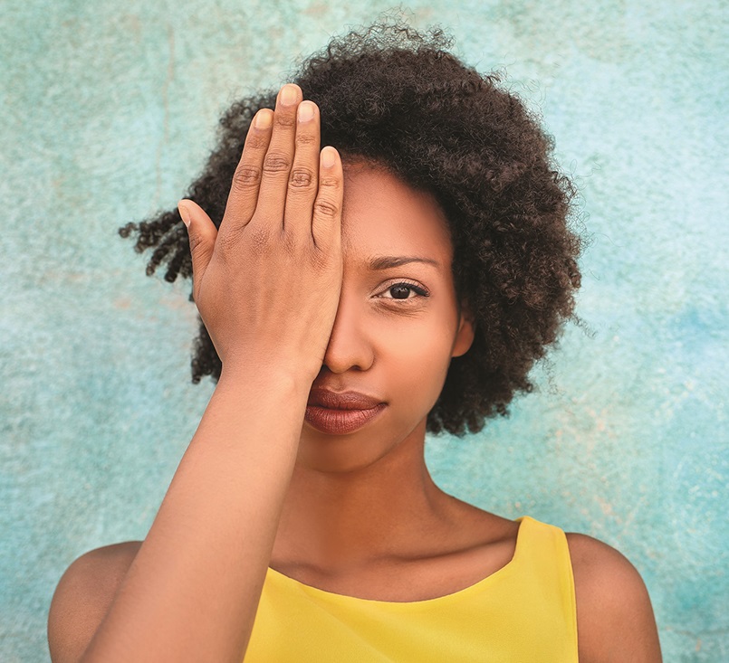 woman with hand over eyes