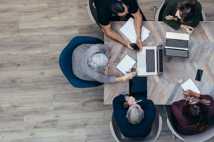 Employees working together at a table