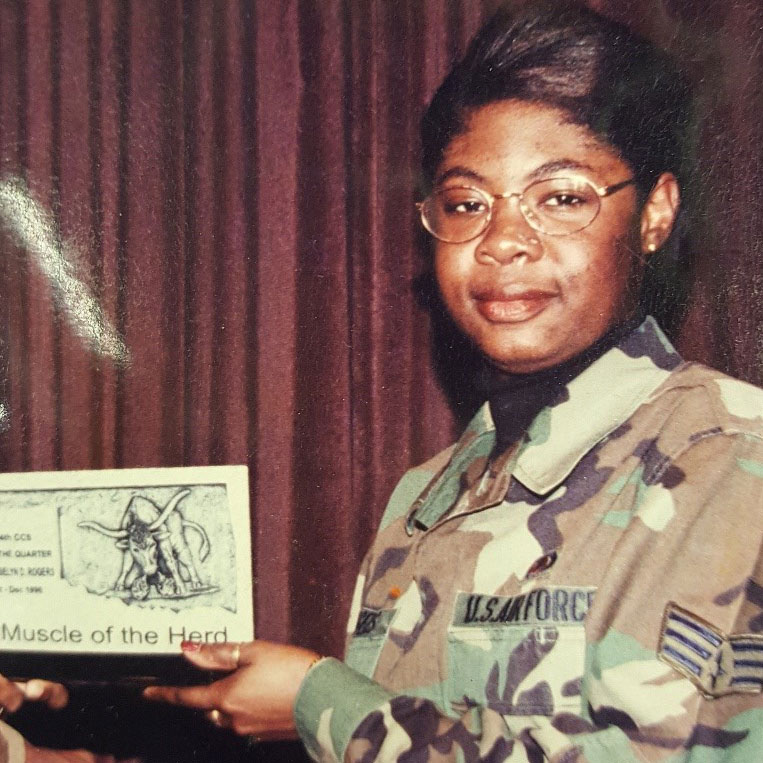 Roselyn Rogers in Air Force uniform with award