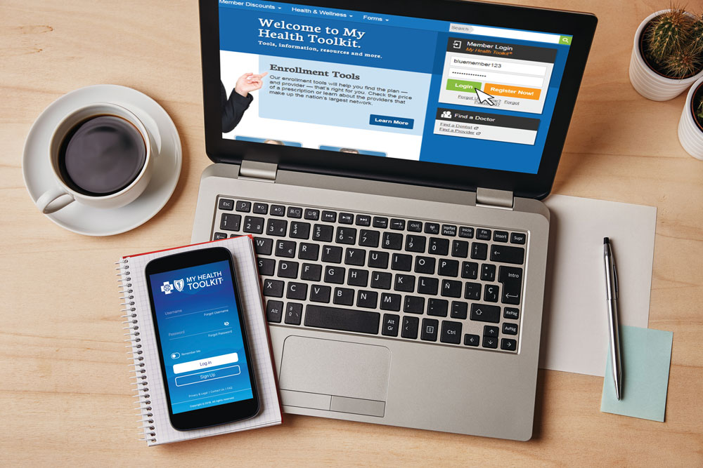 overhead image of computer and phone with my health toolkit open