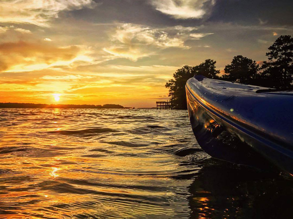 kayak with sunset over lake