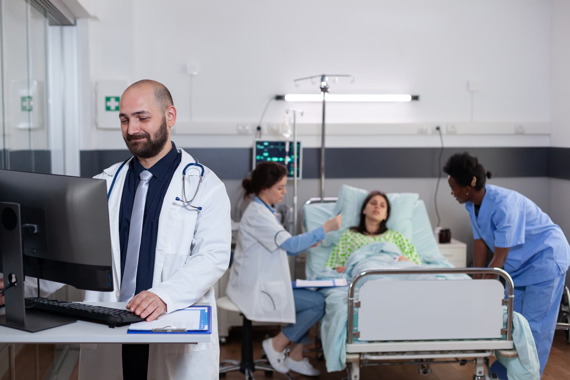 Doctors discuss treatment options with patient at hospital