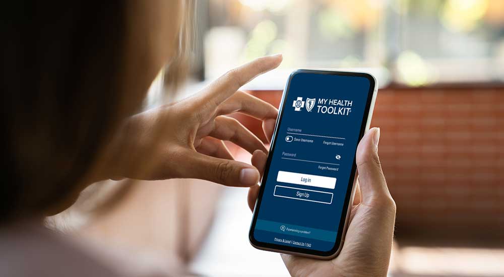 person holding phone with my health toolkit open