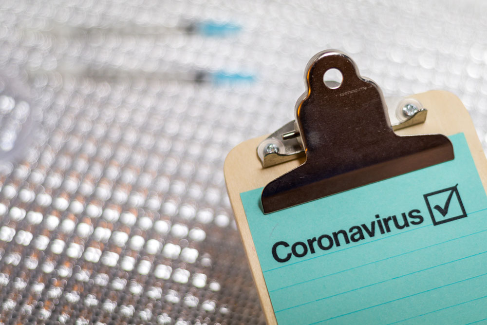 coronavirus notes on a clip board