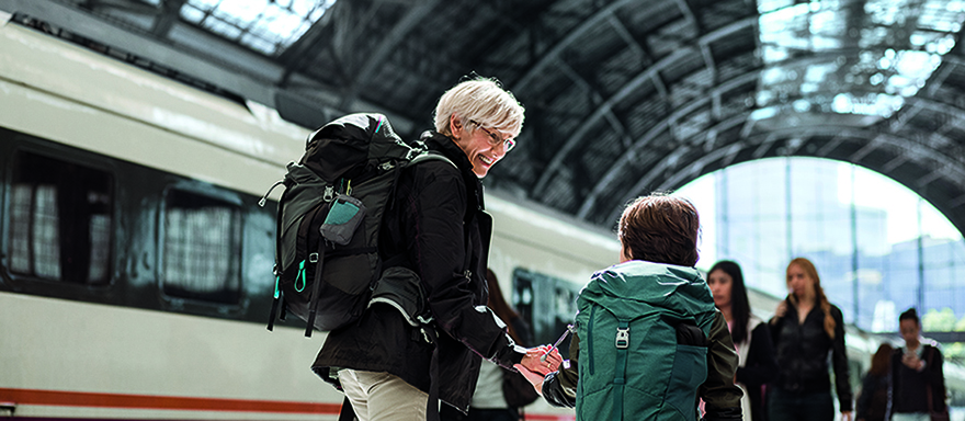 Woman with grandson at a train station